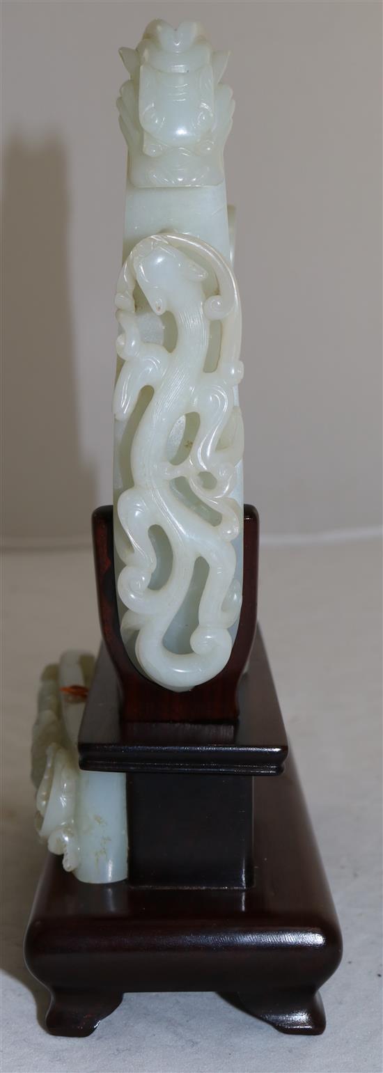 A collection of Chinese archaistic pale celadon jade belt fittings and a white jade archers ring, 17th-19th century,